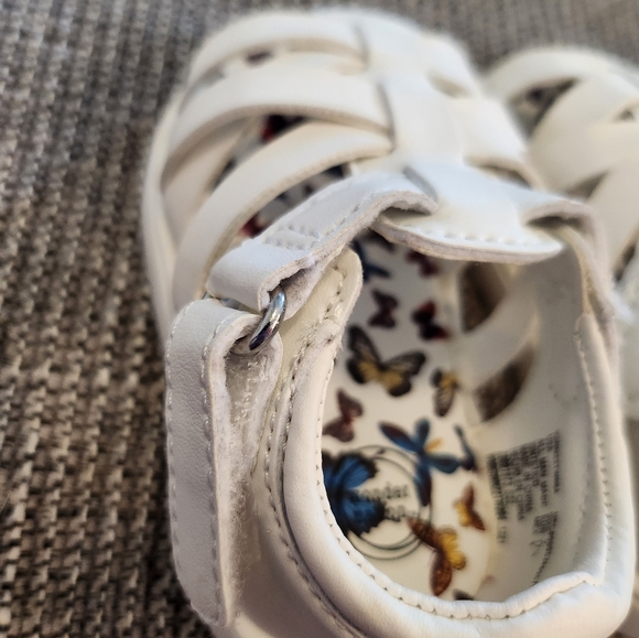 White sandals. Criss-cross design with velcro strap. Toddler sized 2 - Picture 2 of 3